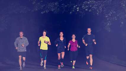 Image showing runners team on the night training