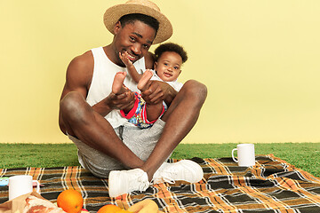 Image showing Happy family having picnic at studio