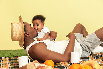 Image showing Happy family having picnic at studio