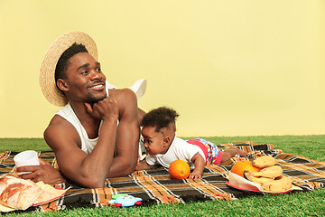 Image showing Happy family having picnic at studio