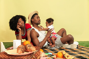 Image showing Happy family having picnic at studio