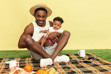 Image showing Happy family having picnic at studio