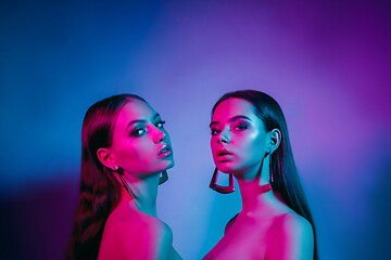 Image showing High Fashion models in colorful bright neon lights posing at studio