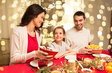 Image showing happy family having christmas dinner at home