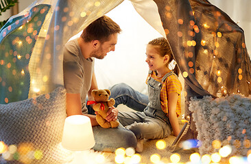 Image showing happy family playing with toy in kids tent at home