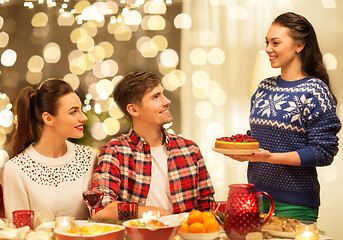 Image showing happy friends having christmas dinner at home