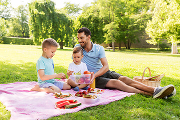 Image showing happy family having picnic at summer park