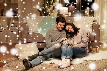 Image showing happy couple with cat at home