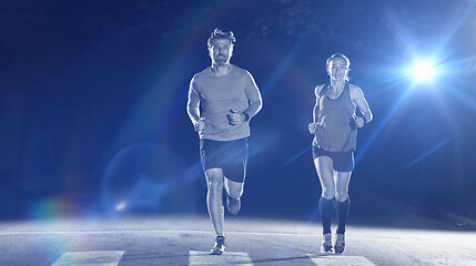 Image showing runners team on the night training