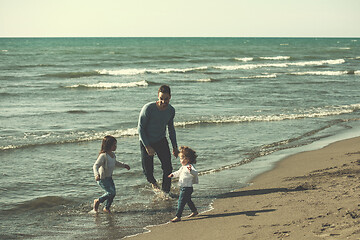 Image showing Young family enjoying vecation during autumn