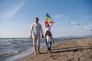 Image showing happy family enjoying vecation during autumn day