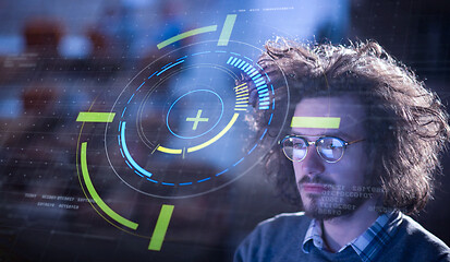 Image showing man working on computer in dark office