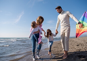 Image showing happy family enjoying vecation during autumn day