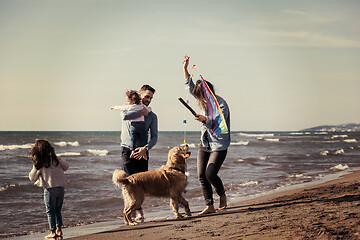 Image showing happy young family enjoying vecation during autumn day