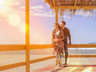 Image showing Couple chating and having fun at beach bar