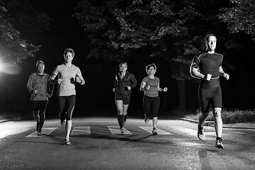 Image showing runners team on the night training