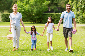 Image showing family with picnic basket walking in summer park