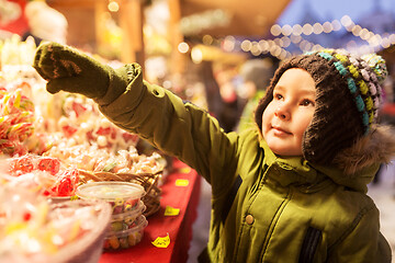 Image showing little boy at christmas market candy shop