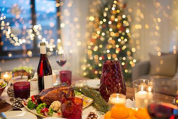 Image showing food and drinks on christmas table at home