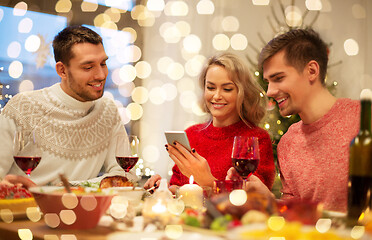 Image showing friends with cellphone celebrate christmas at home