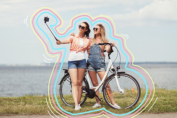 Image showing teenage girls with bicycle taking selfie in summer