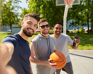 Image showing happy men taking selfie on basketball playground