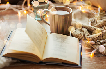 Image showing book and cup of coffee or hot chocolate on table