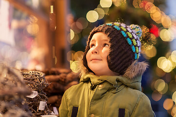 Image showing happy little boy at christmas market in winter