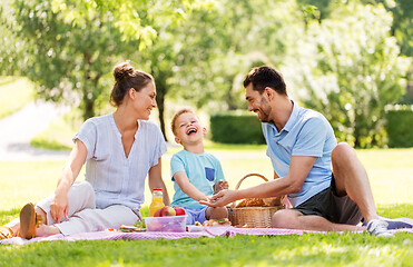 Image showing happy family having picnic at summer park