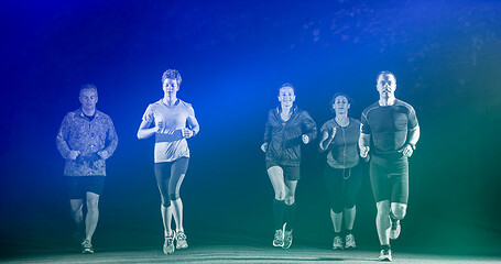 Image showing runners team on the night training