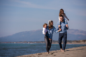 Image showing Young family enjoying vecation during autumn