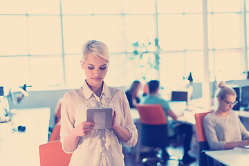 Image showing woman working on digital tablet in night office