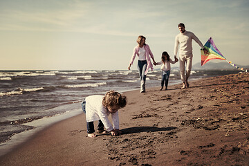 Image showing happy family enjoying vecation during autumn day