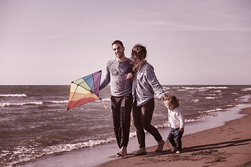 Image showing happy family enjoying vecation during autumn day