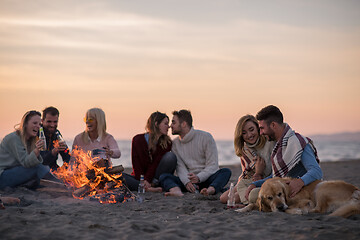 Image showing Friends having fun at beach on autumn day