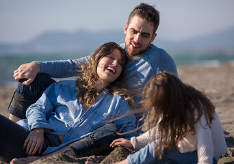 Image showing Young family enjoying vecation during autumn