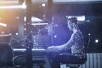 Image showing man working on laptop in dark office