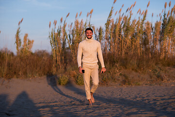 Image showing Young man enjoying the warm autumn day