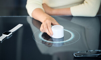 Image showing woman with control knob on interactive panel