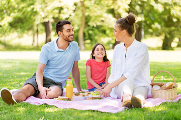 Image showing happy family having picnic at summer park