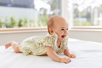 Image showing sweet baby girl lying on white blanket