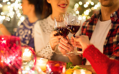 Image showing close up of friends with wine celebrate christmas