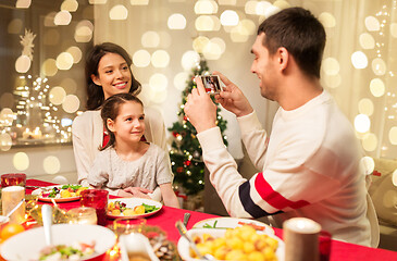 Image showing happy family taking picture at christmas dinner