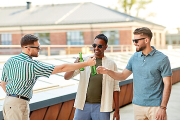 Image showing happy male friends drinking beer at rooftop party