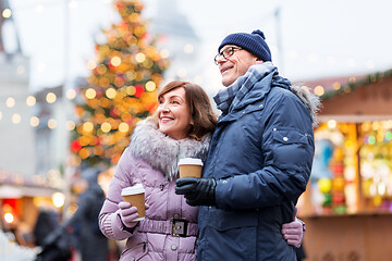 Image showing senior couple with coffee at christmas market