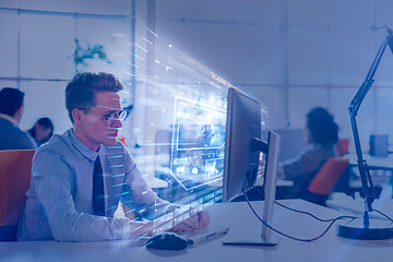 Image showing businessman working using a computer in startup office