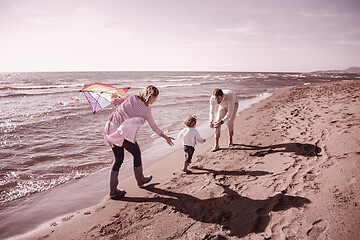 Image showing happy family enjoying vecation during autumn day