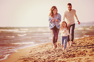 Image showing Young family enjoying vecation during autumn