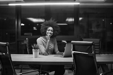 Image showing black businesswoman using a laptop in startup office