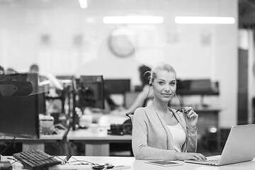 Image showing businesswoman using a laptop in startup office